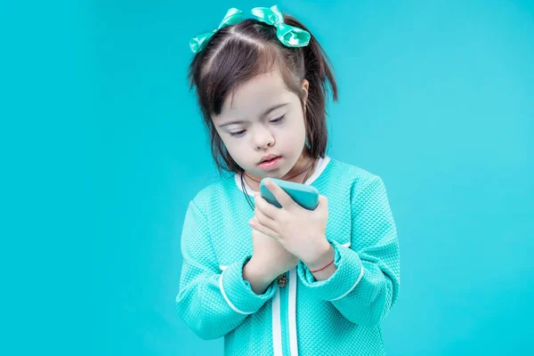 Standing Toy Attentive Dark Haired Girl All Blue Outfit Inspecting — Stock Photo, Image