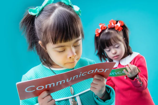 Dark-haired interested girls holding posters with important messages — Stock Photo, Image