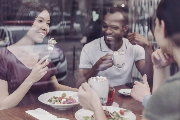 Positive delighted people having dinner — Stock Photo, Image