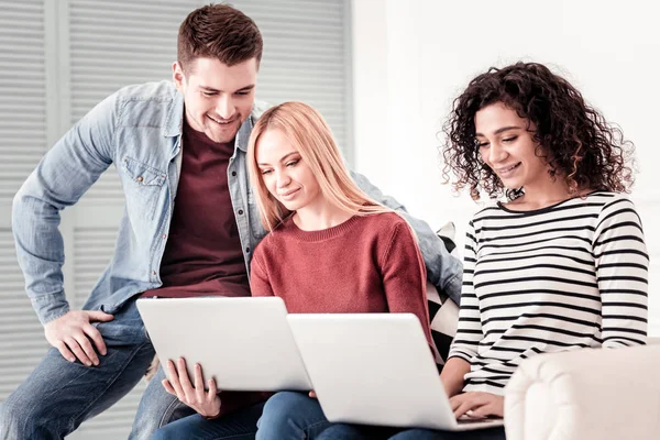 Nice young people using their laptops — Stock Photo, Image