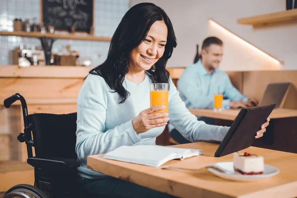 Happy lady watching a movie in a cafe — Stock Photo, Image