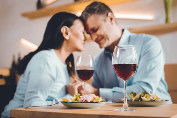 Dreaming couple drinking wine in a restaurant — Stock Photo, Image