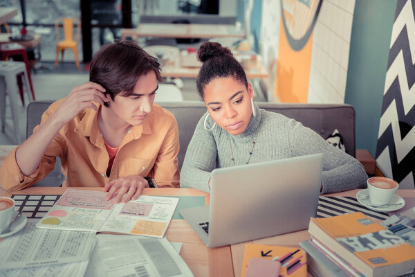 Students learning new skills using online courses