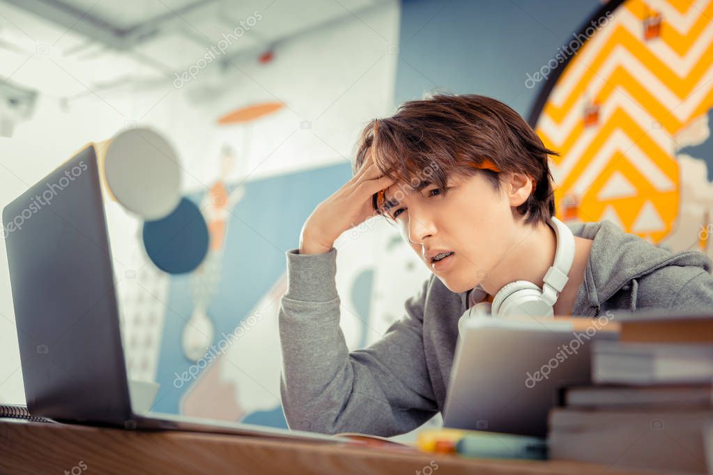Studying engineering. The student having a lot of homework to do