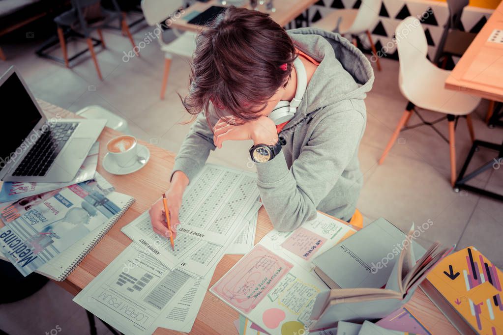 The crucial test. The student preparing for the important language test