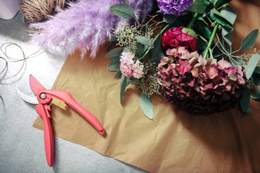 Close up of flowers that lying on craft paper
