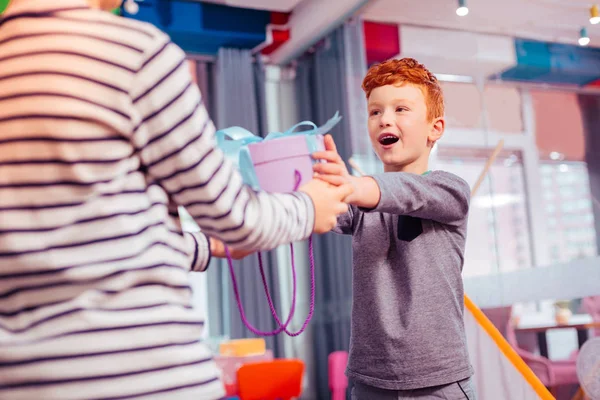 Cheerful teenager visiting party of his friend — Stock Photo, Image