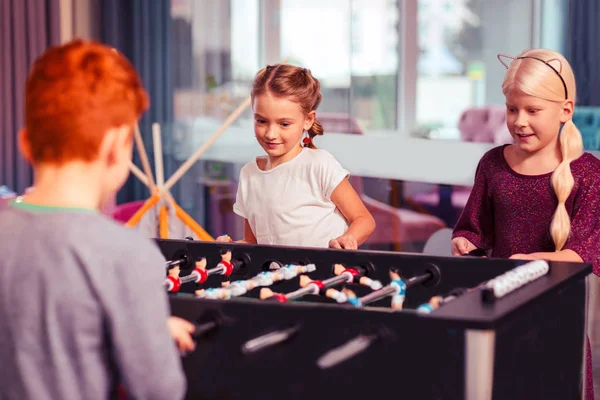 Attentive pretty girls looking at table game — Stock Photo, Image