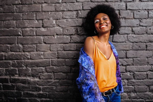 Adorable african american model in a trendy shirt posing for the photo — Stock Photo, Image