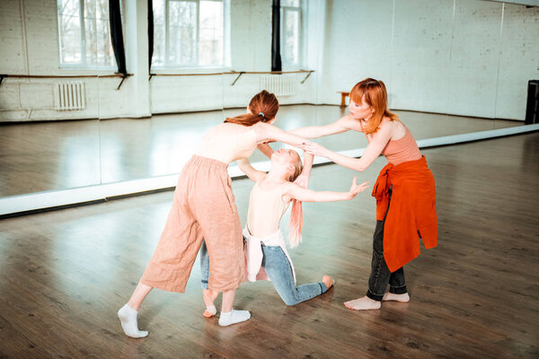 Two students of a dance school working under a new dance in the studio