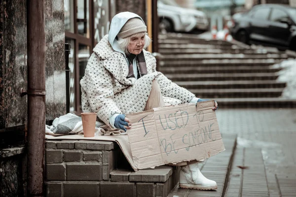 Sad aged woman thinking about her previous life — Stock Photo, Image