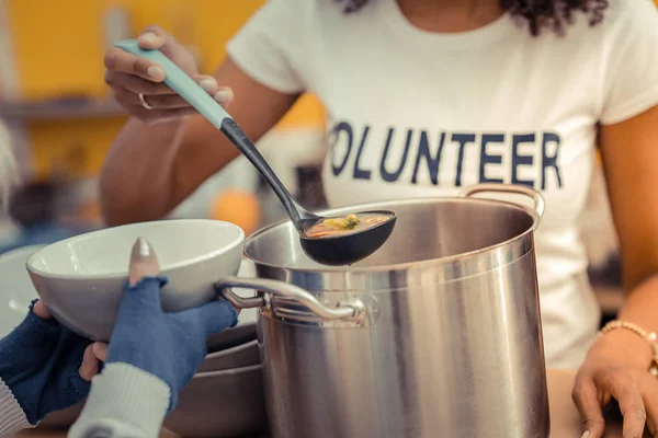 Close up a ladle being filled with soup — Stock Photo, Image