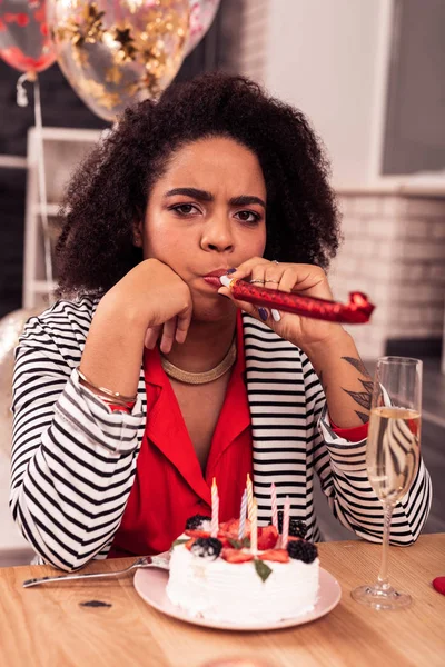 Sad young woman being alone for birthday