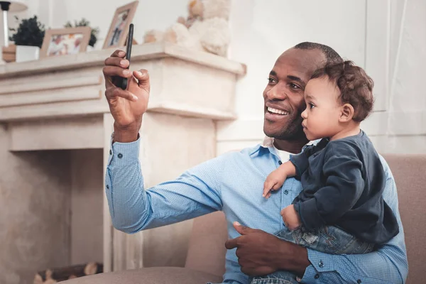 Happy positive man taking a selfie — Stock Photo, Image