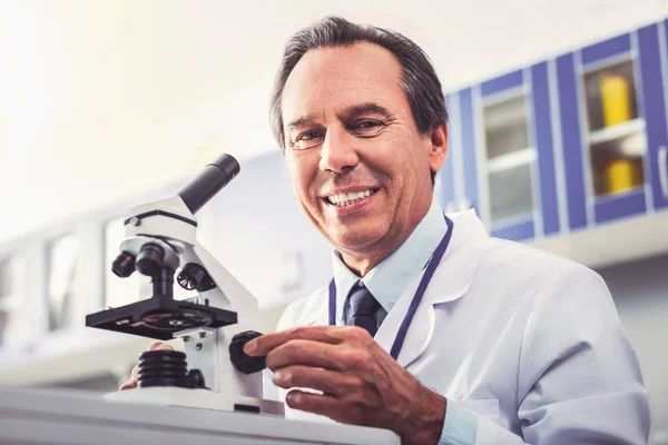 Researcher smiling while inventing new technology for microscope — Stock Photo, Image