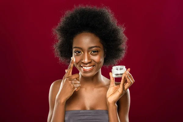 Positive young woman caring about her skin — Stock Photo, Image