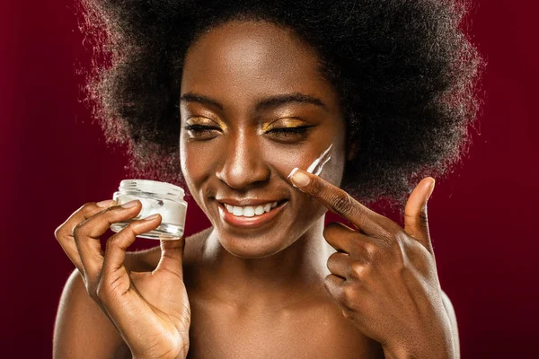 Delighted nice woman using organic facial cosmetics — Stock Photo, Image