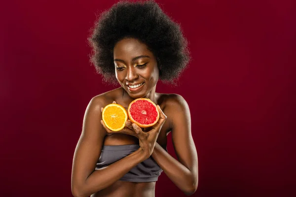 Attractive afro American woman having fruits in her hands — Stock Photo, Image