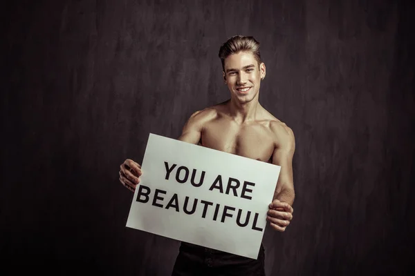 Positive handsome young man expressing his support — Stock Photo, Image