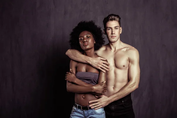 Handsome blonde man standing near his girlfriend