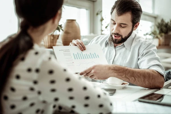 Pleased brunette man working with analytical task — Stock Photo, Image