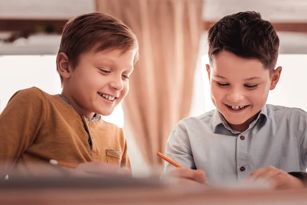 Two adopted children smiling broadly while communicating — Stock Photo, Image