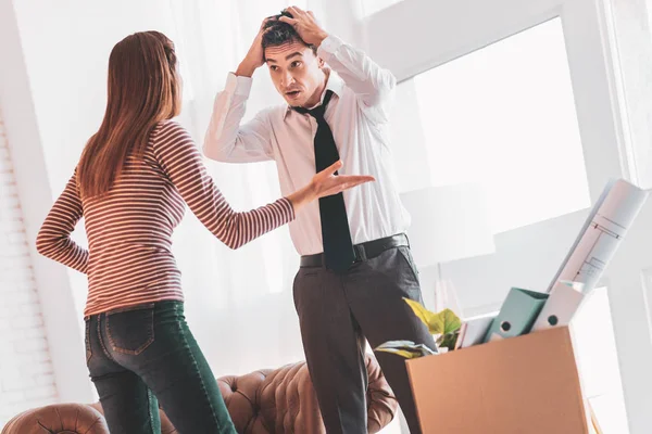 Upset man losing his job and his wife feeling angry — Stock Photo, Image