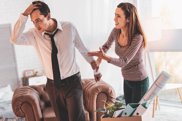 Unhappy couple having a terrible quarrel and feeling tired of it