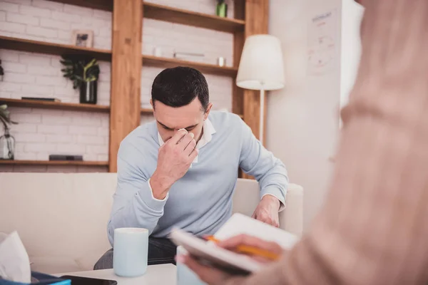 Upset brunette male person talking about his problems — Stock Photo, Image