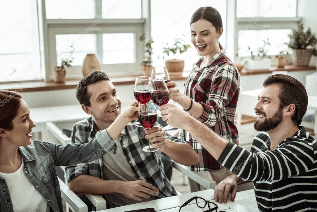 Positive delighted woman keeping smile on her face