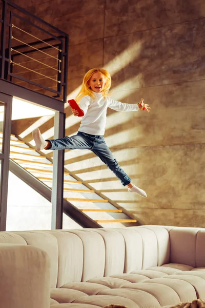 Positive delighted blonde girl looking at camera — Stock Photo, Image