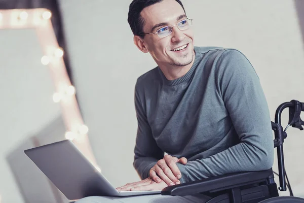 Smart disabled man using a laptop — Stock Photo, Image