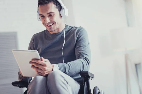 Nice disabled man using a tablet — Stock Photo, Image