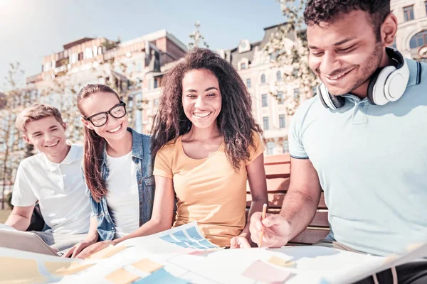 Delighted group mates looking at new plan — Stock Photo, Image