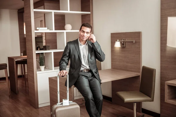 Young businessman staying in hotel having business trip
