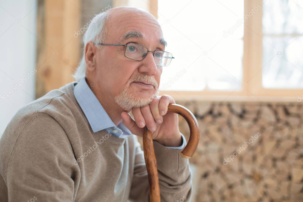 Attractive senior man thinking about future