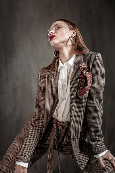 Attractive young female posing isolated on grey — Stock Photo, Image