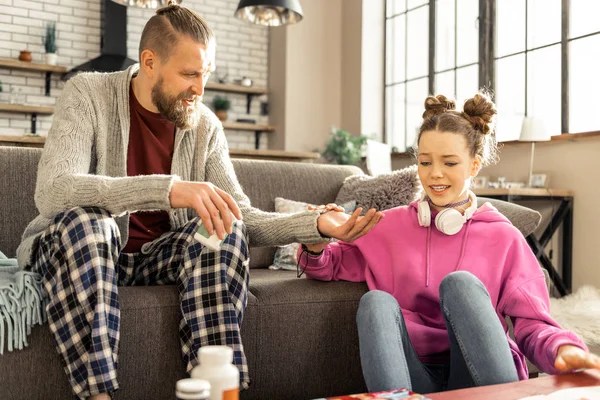 Girl bursting in tears speaking with father about family problems