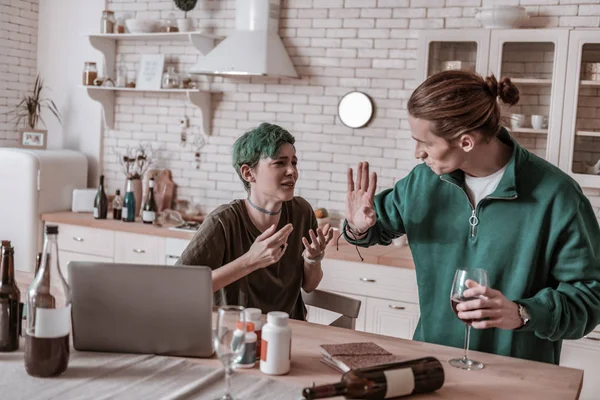 Loving boyfriend asking his addicted girlfriend to stop drinking