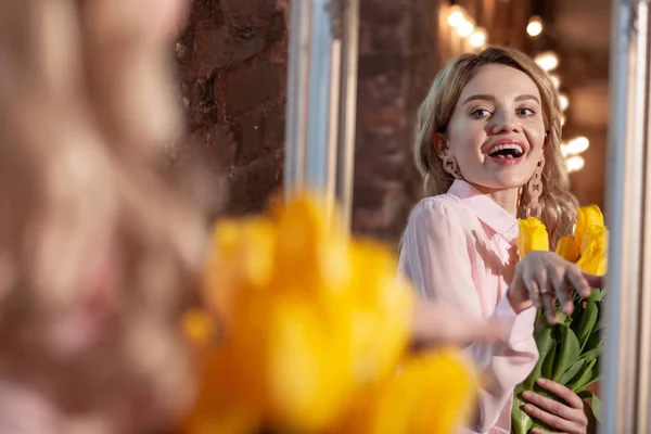 Stylish beaming blonde woman feeling happy after romantic date — Stock Photo, Image