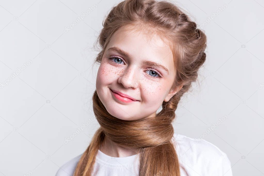 Appealing blonde young lady with wide smile