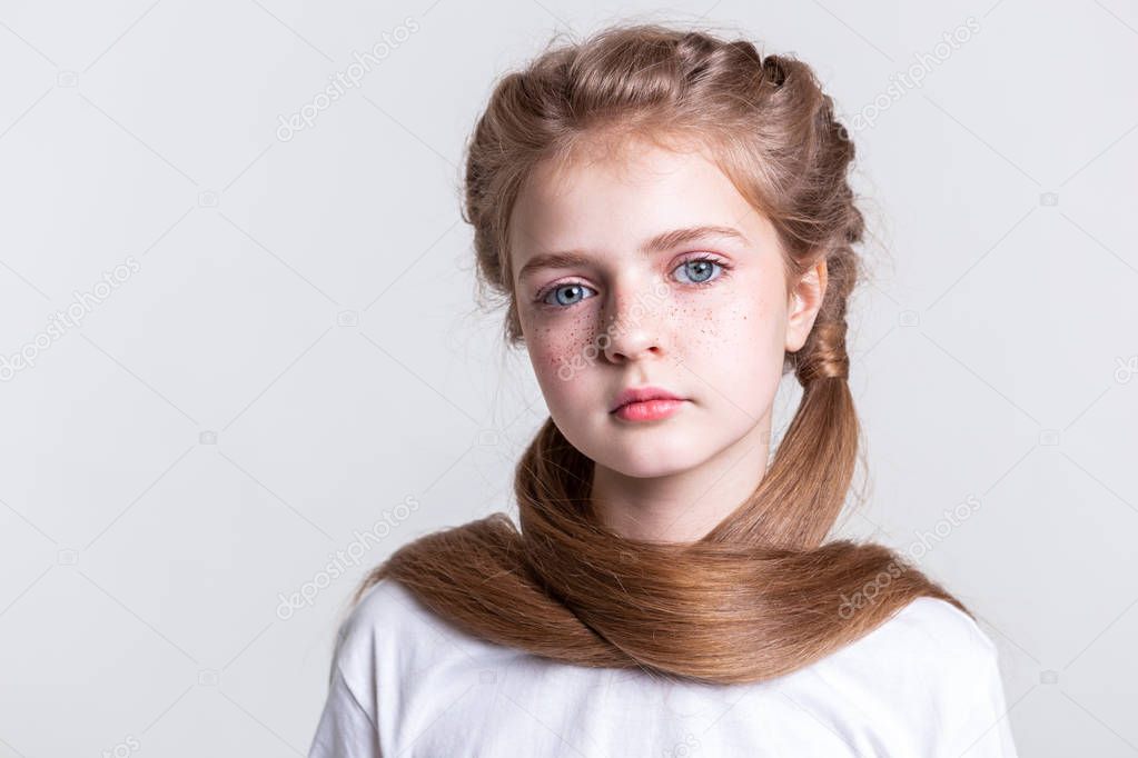 Appealing good-looking young girl covering herself with long hair