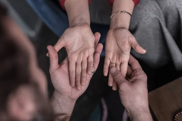 Top view of female palms in chiromancers hands — Stock Photo, Image