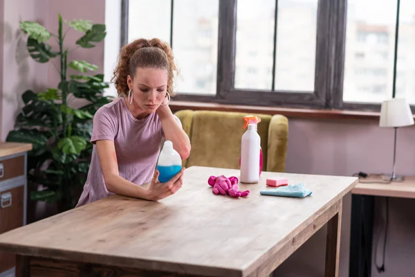 Upset good-looking lady being concentrated on information