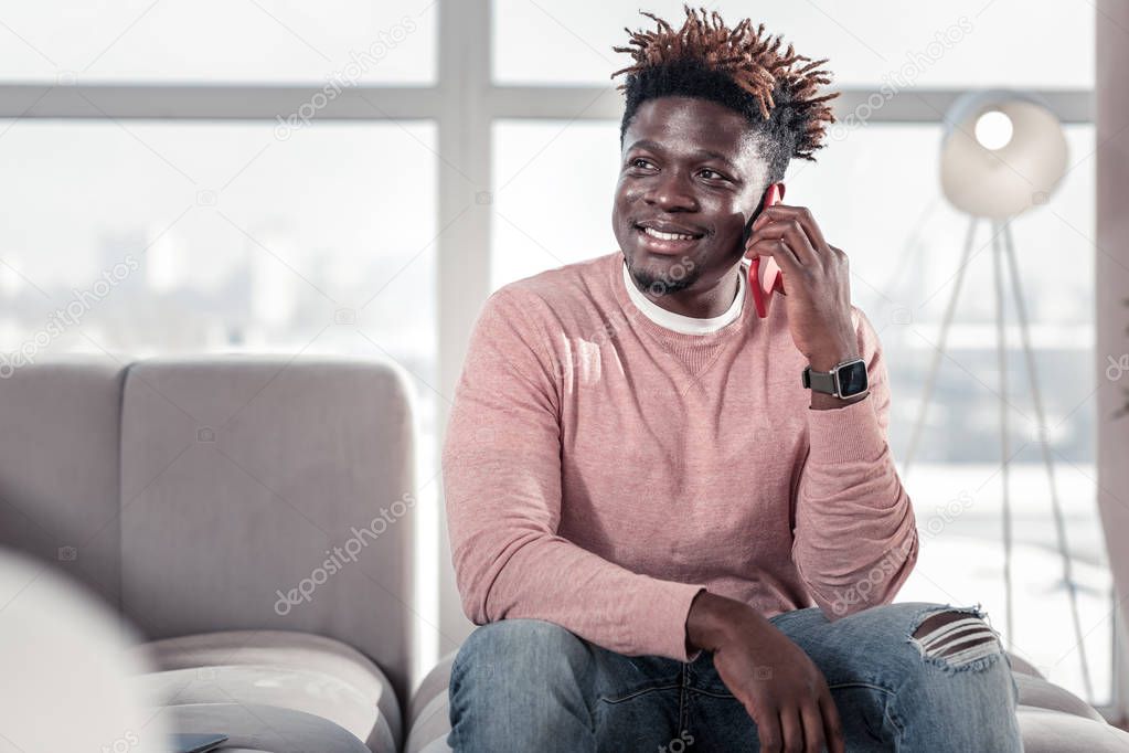Relaxed brunette male person listening to his interlocutor