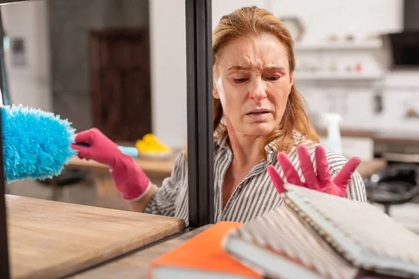 Aged blond-haired woman suffering from strong allergy to dust — Stock Photo, Image