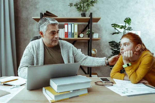 Nice pleasant man looking at his daughter — Stock Photo, Image