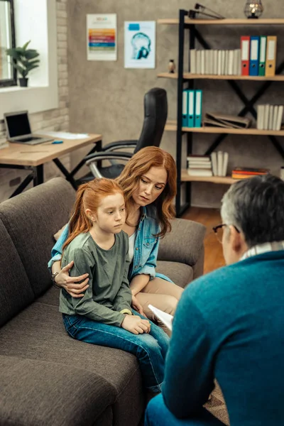 Pleasant nice woman worried about her daughter