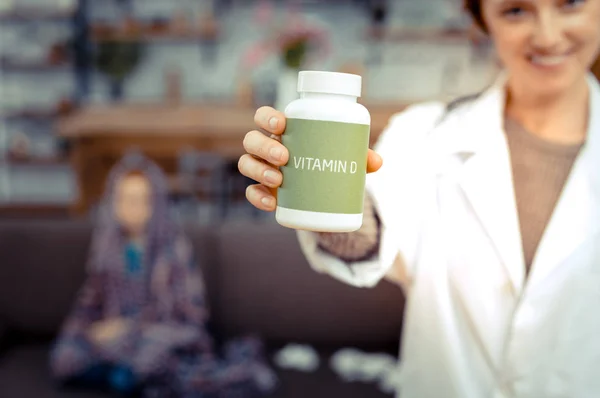 Selective focus of a bottle with vitamin D — Stock Photo, Image