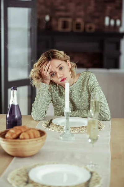 Curly blonde wife feeling melancholic staying alone at home — Stock Photo, Image